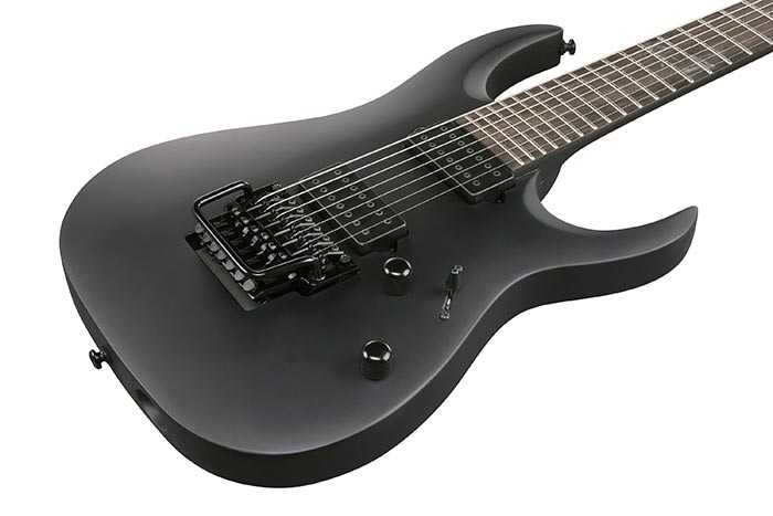 Ibanez K7YIN Munky Signature 7-string electric guitar in black with sleek body, six strings, and signature design details.