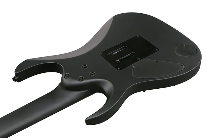 Ibanez K7YIN Munky Signature 7-string electric guitar in black with sleek body and six-string neck, showcasing signature design details.