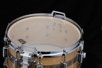 Tama 50th Limited Mastercraft ARTWOOD 14x6.5 inch snare drum with wooden finish and metal hardware, showcasing intricate craftsmanship.