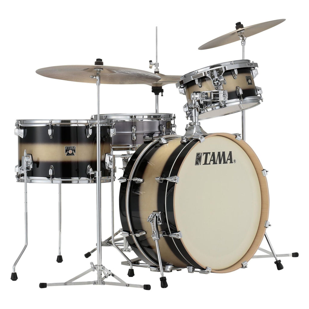 Tama Superstar Classic 3-piece drum kit in black and gold duco with toms, bass drum, and snare, on a stage setup.