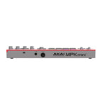Grey Akai MPK Mini 4 MIDI controller keyboard with compact design, featuring keys, knobs, and pads for music production.
