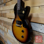 Gibson Les Paul Junior electric guitar in vintage tobacco burst with single cutaway and humbucking pickup, showcasing classic design.