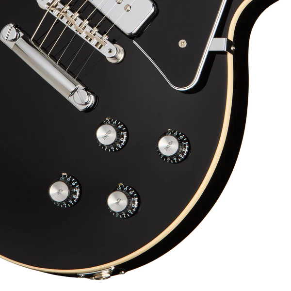 Gibson Noel Gallagher Les Paul Standard electric guitar in ebony finish, with dual humbucker pickups and chrome hardware.