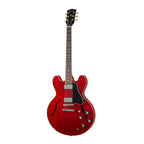 Gibson ES335 Sixties electric guitar in cherry finish, showcasing its double-cutaway body, f-holes, and vintage-style hardware.