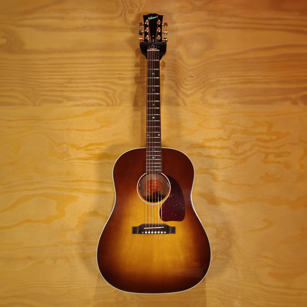 Gibson Limited Edition J45 acoustic guitar with Australian Blackwood top, showcasing its rich wood grain and classic shape.