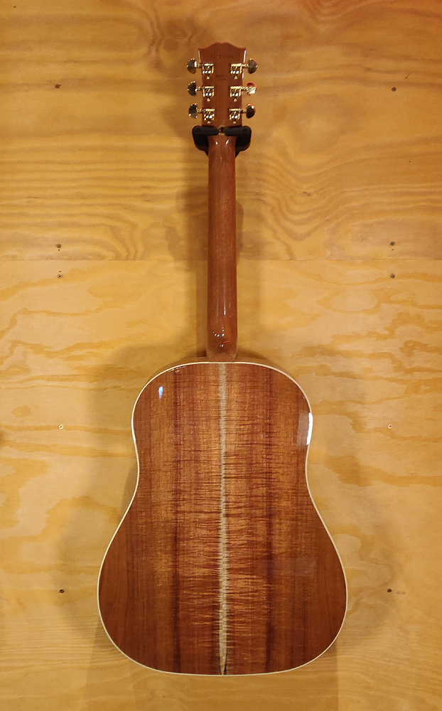 Gibson Limited Edition J45 acoustic guitar with Australian Blackwood top and body, showcasing its natural wood grain and classic design.