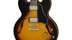 Epiphone ES-335 semi-hollow body electric guitar in vintage sunburst finish, showcasing double-cutaway design and dual humbucker pickups.