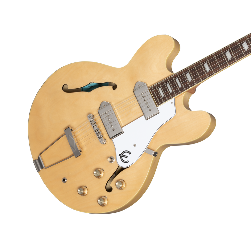 Epiphone Casino electric guitar in natural finish with hollow body and dual humbucker pickups, displayed on a stand.