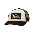 Fender 1946 Gold Braid Guitar Hat in cream and black with gold braid detailing, designed for guitar enthusiasts.