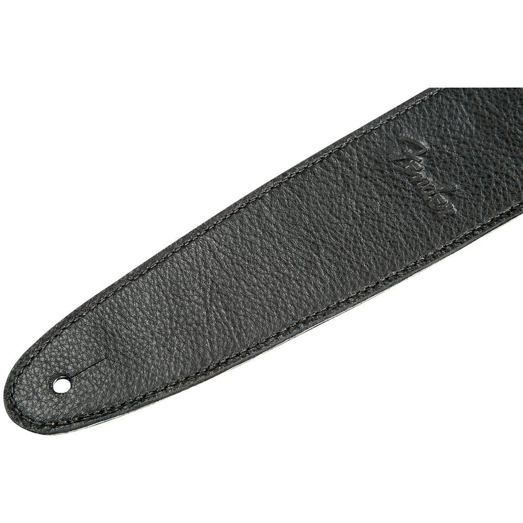 Black Fender Artisan Crafted 2.5-inch leather guitar strap with detailed stitching and adjustable ends.