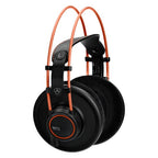 AKG K712 Pro reference studio headphones with closed-back design and over-ear cushions, black color, and detailed ear cups.