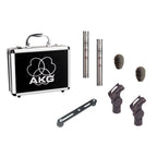Pair of AKG C451B small diaphragm condenser studio microphones with case and stereo bar, ideal for detailed audio recording.