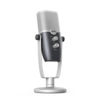 AKG ARA USB condenser microphone on a desk with a black stand, featuring a sleek black body and USB connector for recording.