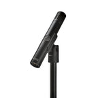 AKG C151 small diaphragm condenser microphone for studio recording, shown with its sleek black body and gold accents.
