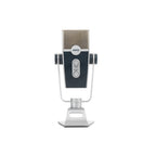 AKG Lyra USB microphone on a desk, featuring a sleek design with multiple pickup modes and a sturdy stand for professional audio recording.