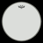Remo Emperor Clear 13-inch drumhead showing the transparent surface with brand logo and drumhead specifications.