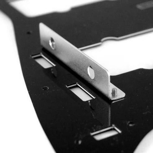 Allparts USA Jazzmaster guitar pot bracket showing metal component with mounting holes for guitar control assembly.