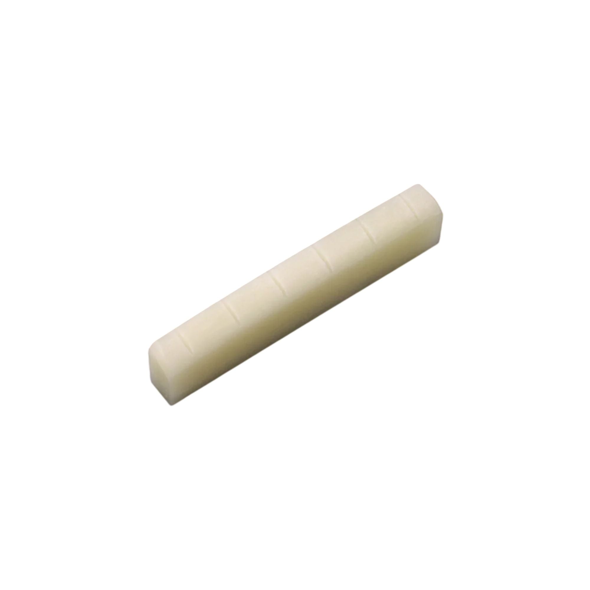 Allparts USA slotted bone nut for Gibson guitars, flat bottom guitar part, showing the detailed bone material and slot design.