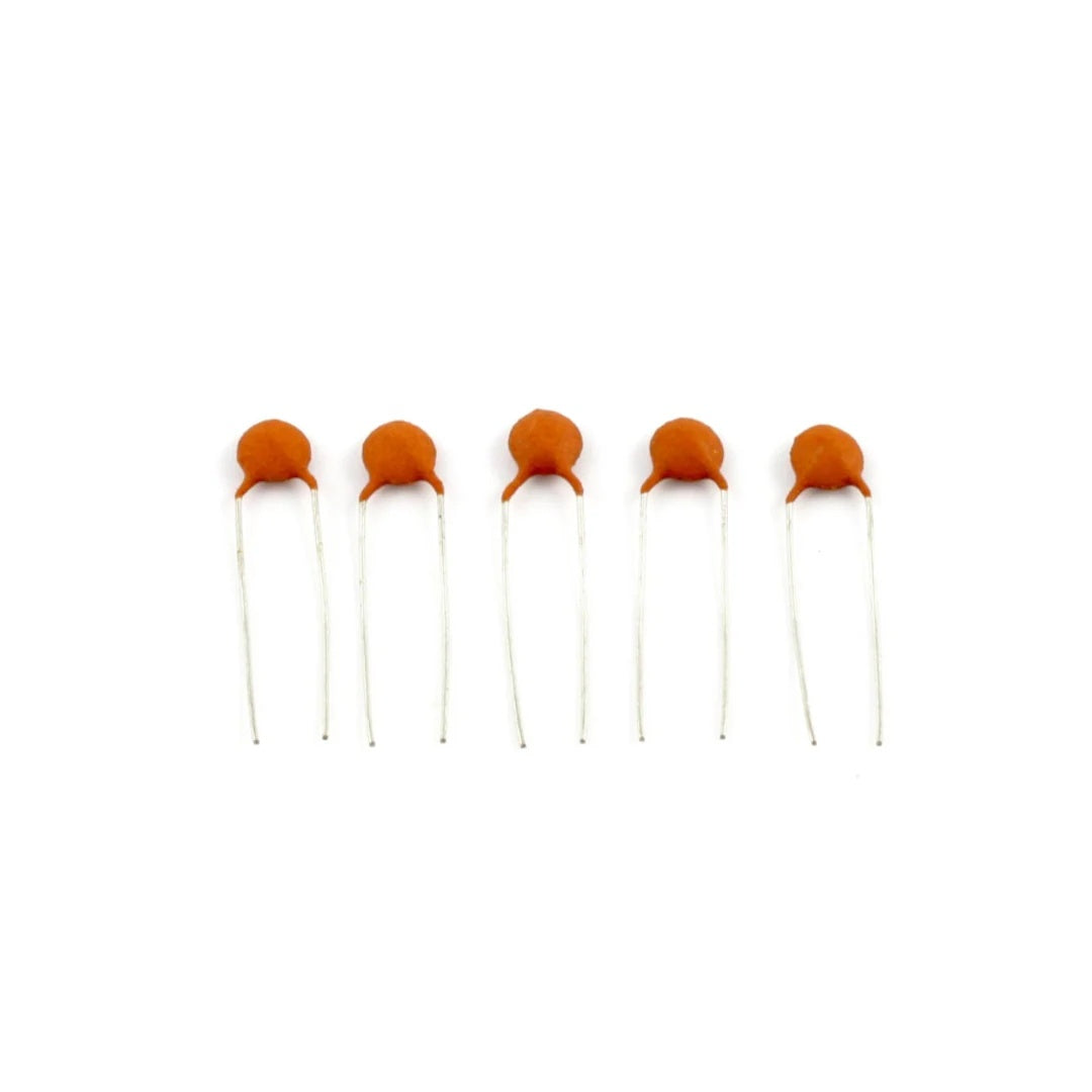 Allparts USA .02mfd ceramic capacitor for guitar parts, small cylindrical component with metal leads on a white background.