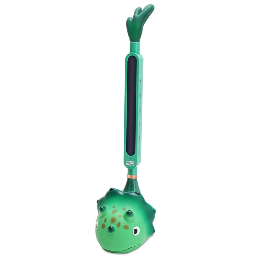 A-Pro Otamatone portable electronic synthesizer in green dinosaur design, with a playful, colorful appearance for gifts and novelty use.