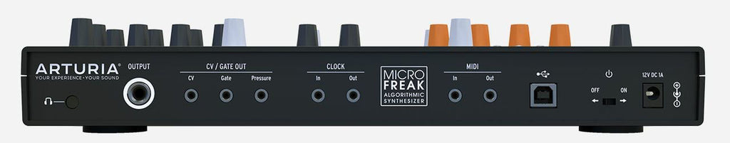 Arturia Microfreak hybrid synthesizer keyboard with colorful control panel and various knobs and keys in a studio setting.