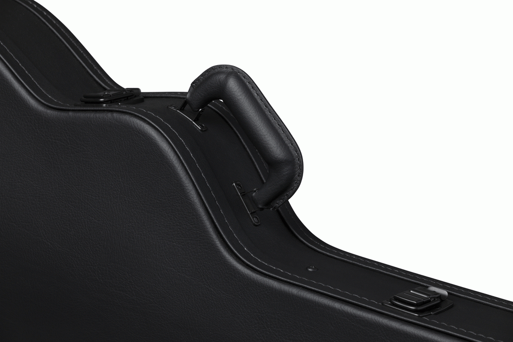 Gibson ES-335 modern electric guitar in a hardshell case, showing the sturdy black exterior and padded interior for protection.