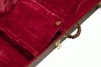 Gibson Firebird Modern electric guitar hardshell case showing sturdy black exterior and padded interior for guitar protection.