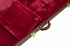 Gibson Thunderbird modern electric guitar in a hardshell case, showing the padded interior and sturdy exterior for protection.