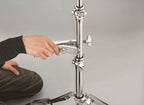 Tama MC66 universal drum clamp attached to drum hardware, showcasing durable metal construction and adjustable tightening mechanism.