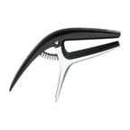 Ibanez ICGC10 universal guitar capo clipped on the neck of an acoustic guitar, showing its black, compact design and adjustable tension.