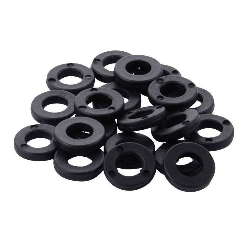 Tama PW620 tension washers made of nylon for drum hardware, shown in close-up with a drum surface in the background.