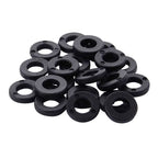 Tama PW620 tension washers made of nylon for drum hardware, shown in close-up with a drum surface in the background.