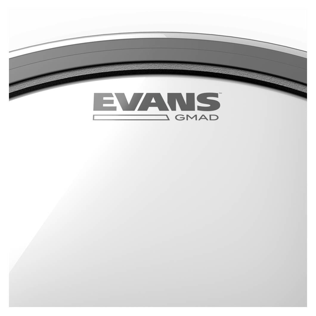 Evans GMAD 24-inch clear bass drum head with black logo, mounted on a bass drum, showing the drum head's smooth surface.