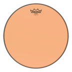 Orange Remo Emperor Colortone 12-inch drum head showing vibrant color and branding on a drum surface.