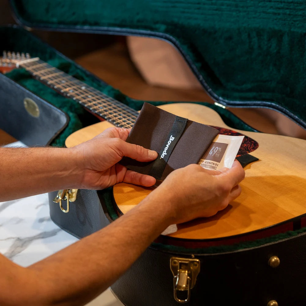 Boveda Large 2-Way Humidity Control Starter Kit for guitar accessories, including humidity packs and storage case in the image.