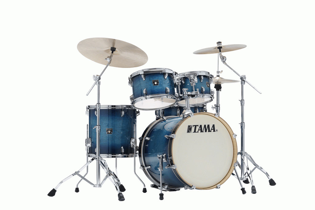 Tama Superstar Classic 20-inch 5-piece drum kit shell pack in blue lacquer burst finish with drums and hardware visible.