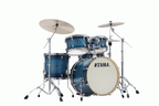 Tama Superstar Classic 20-inch 5-piece drum kit shell pack in blue lacquer burst finish with drums and hardware visible.