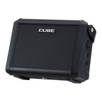 Roland Cube Street Mini guitar amplifier with two speakers, controls, and built-in handles for portable sound.