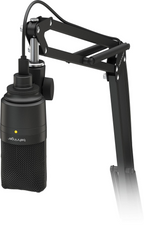Behringer D3 USB microphone from the podcast studio microphone bundle, showing the black microphone with stand and cable.
