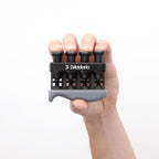 Planet Waves VariGrip hand exerciser for guitar, black plastic grip with adjustable resistance, used for finger and hand strength training.
