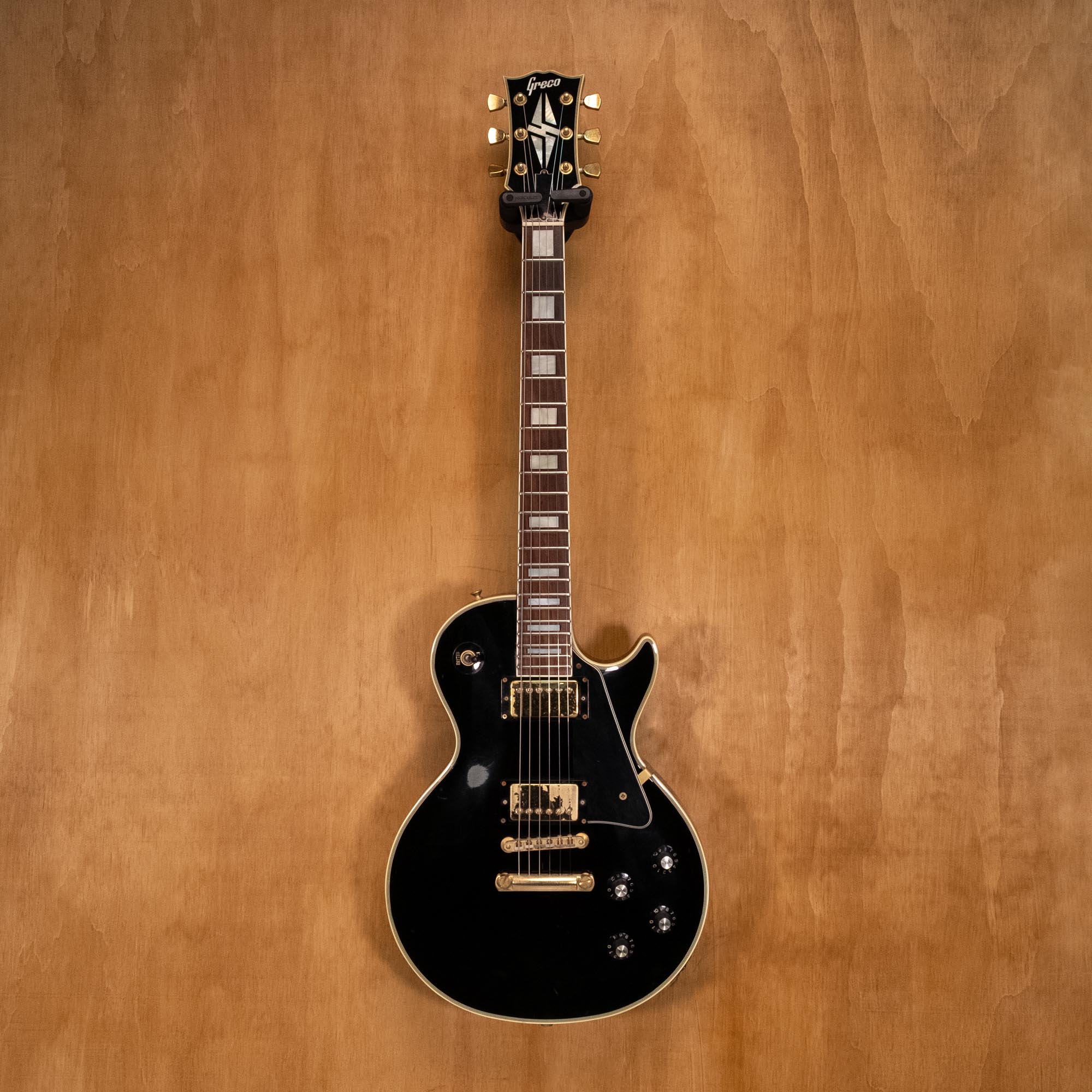 Greco EGC-550 Les Paul electric guitar in ebony finish, made in Japan, with dual humbucker pickups and classic guitar body shape.