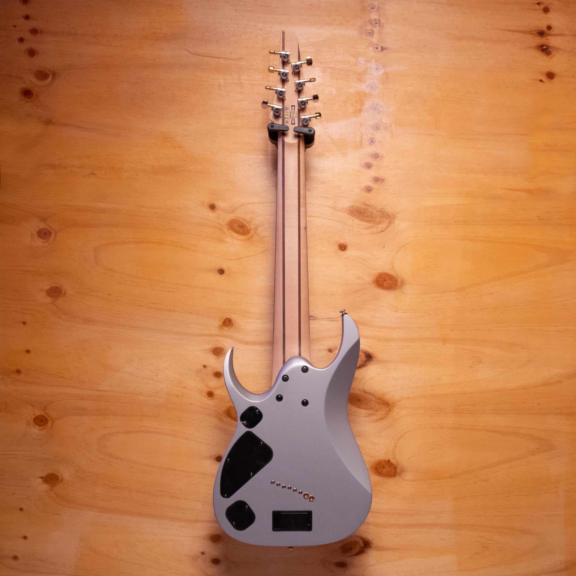 Ibanez RGD Axe DesignLab RGDMS8 8-string electric guitar in classic silver matte, showing the multi-scale body and sleek design.