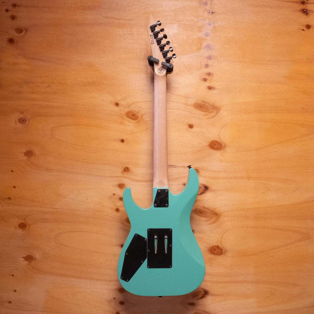ESP LTD Mirage '87 Series electric guitar with sleek black finish and modern design, shown from the front with detailed hardware.