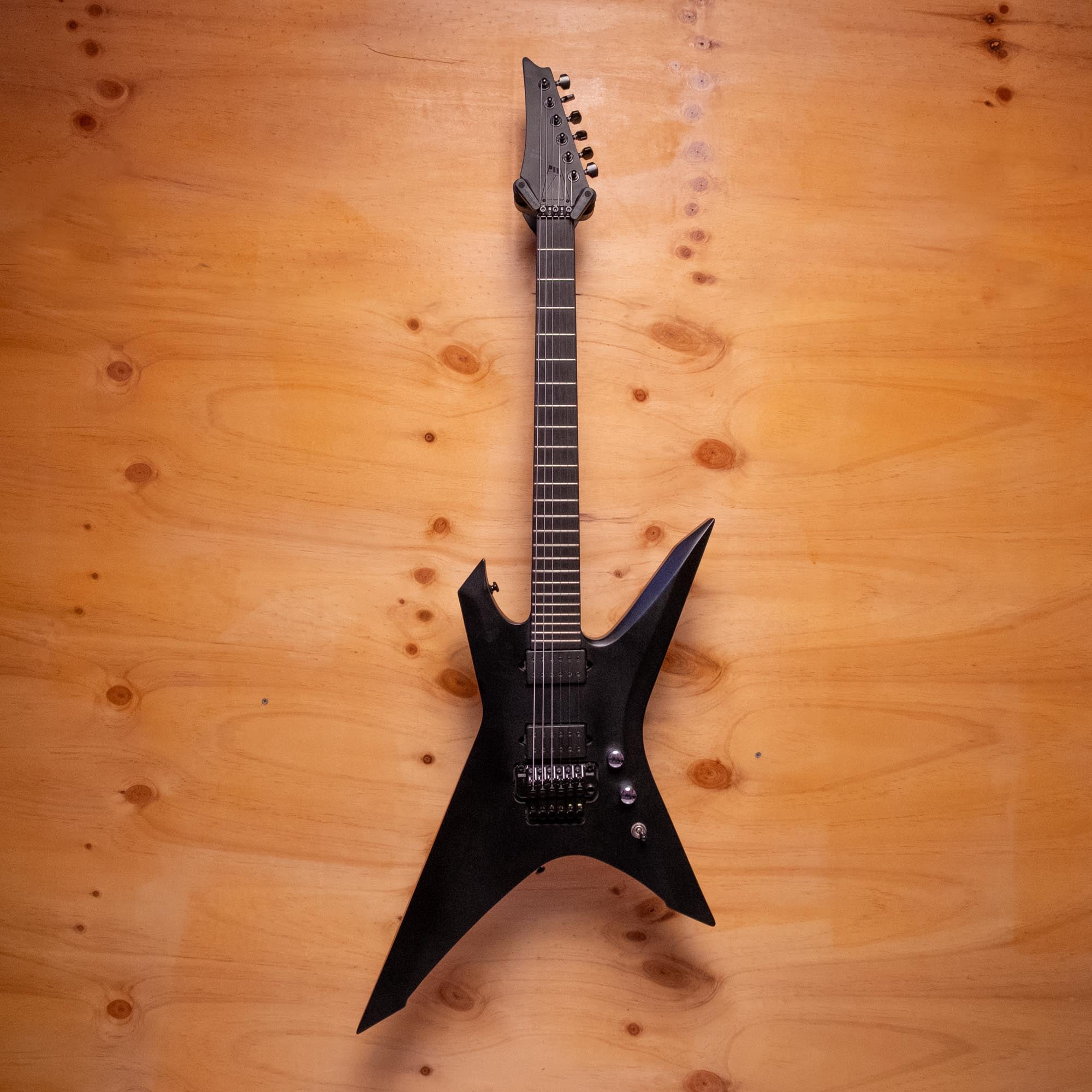Ibanez Iron Label Xiphos XPTB620 electric guitar in black flat finish, showcasing its sleek body and hardware details.