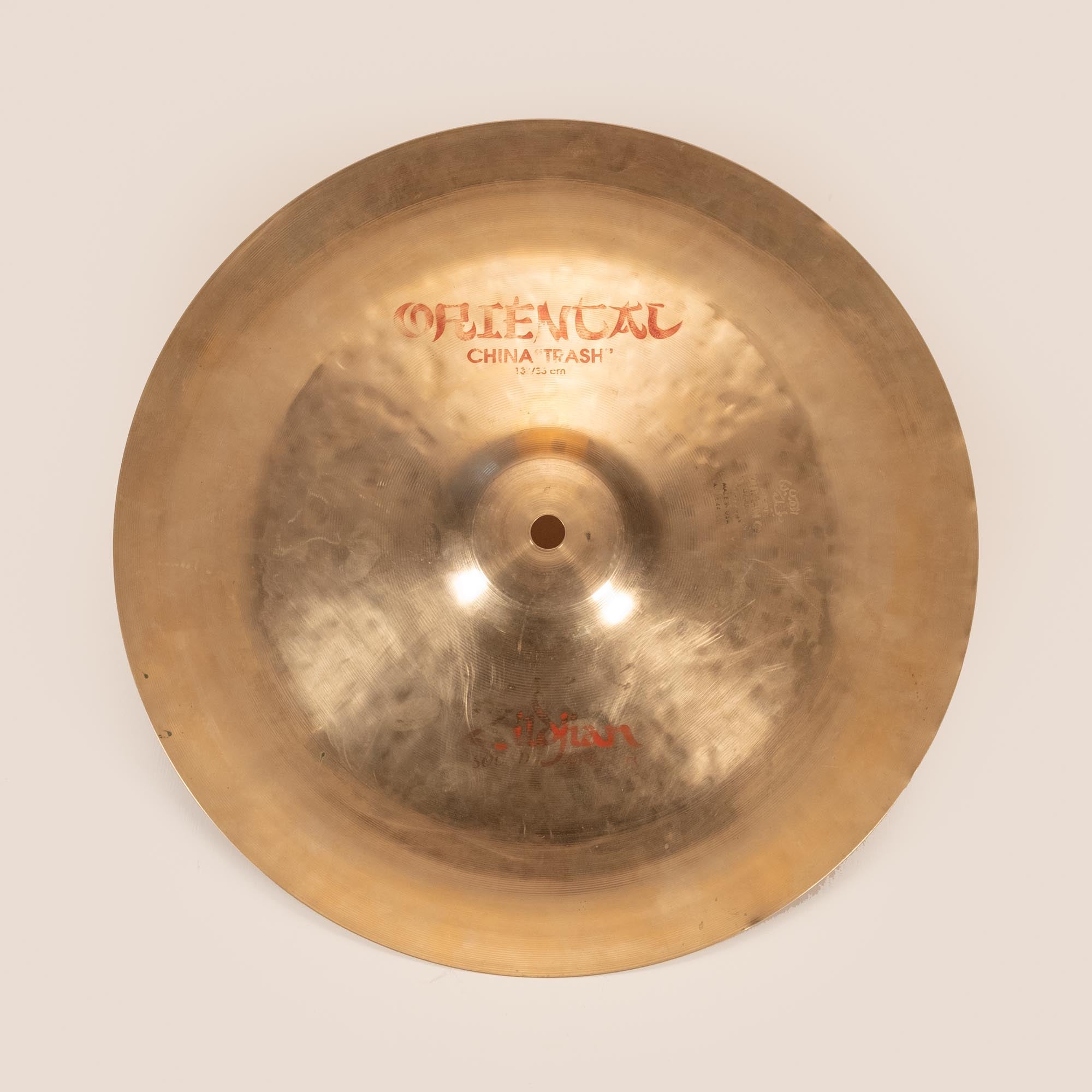 Preloved Zildjian 13-inch Oriental China Trash Cymbal, single cymbal with dark, intricate surface and traditional cymbal design.