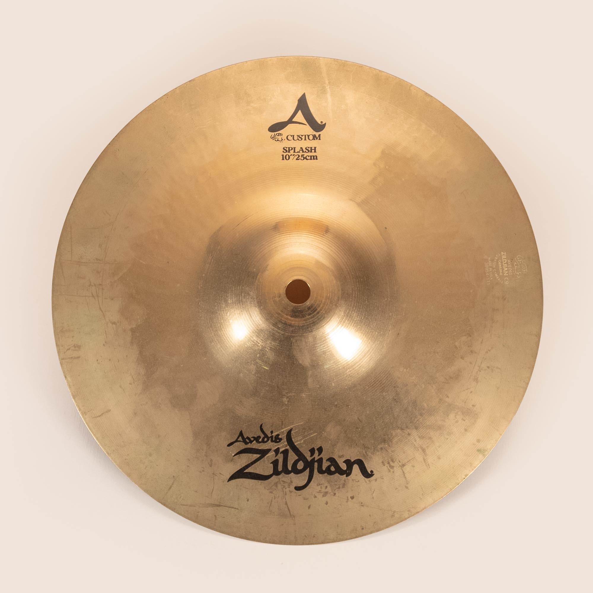 Preloved Zildjian 10-inch A Custom Splash cymbal, single percussion cymbal with a shiny finish and detailed logo visible.