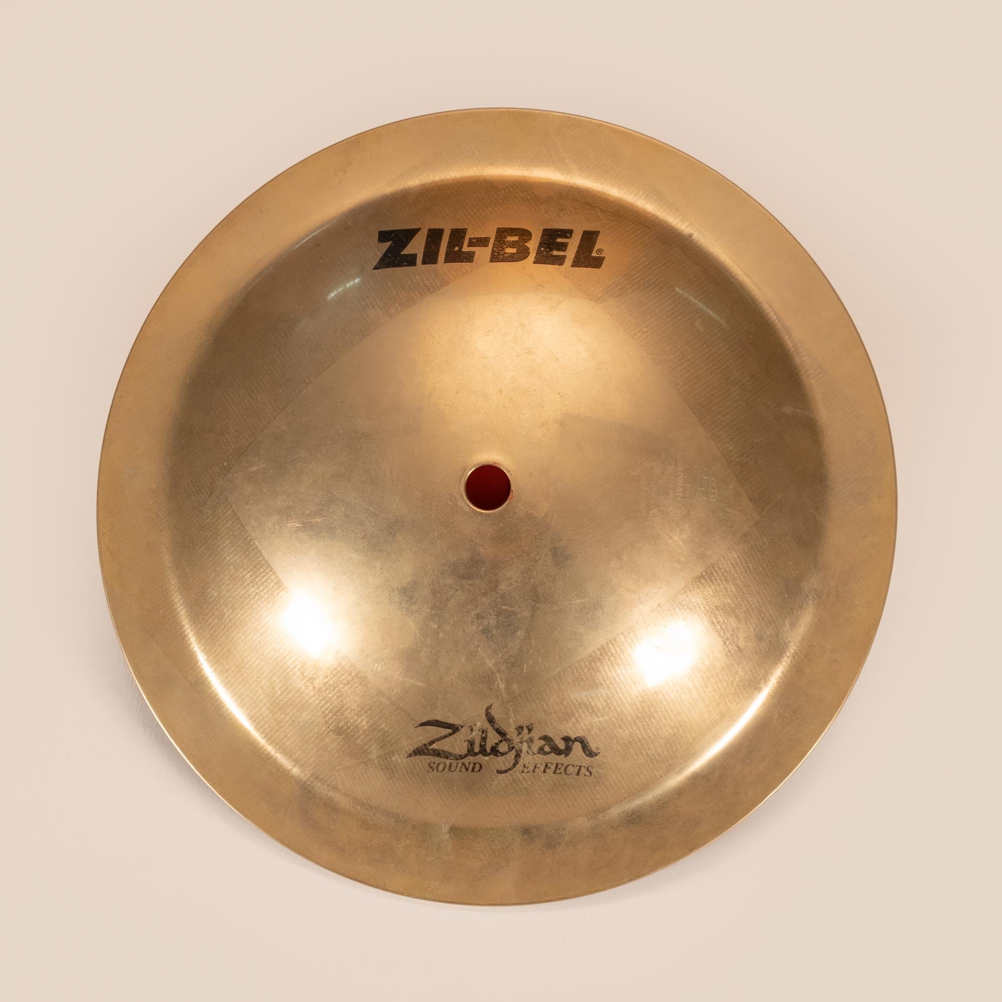Preloved Zildjian 9.5-inch ZIL-BEL cymbal, single percussion cymbal with aged finish, used for drumming and percussion music.