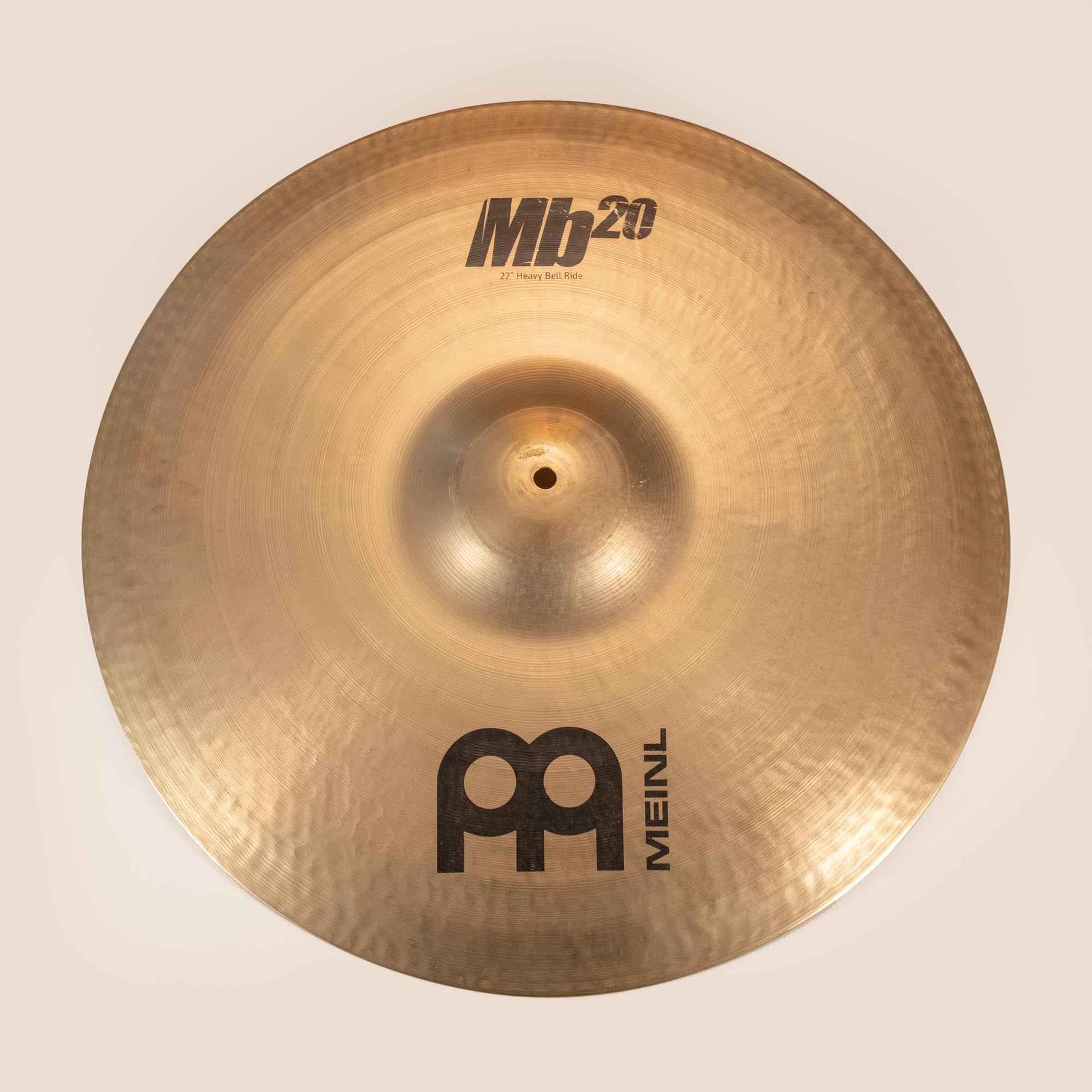 Preloved Meinl 22-inch MB20 Heavy Bell Ride Cymbal, single cymbal with a polished bronze finish, showing detailed surface texture.