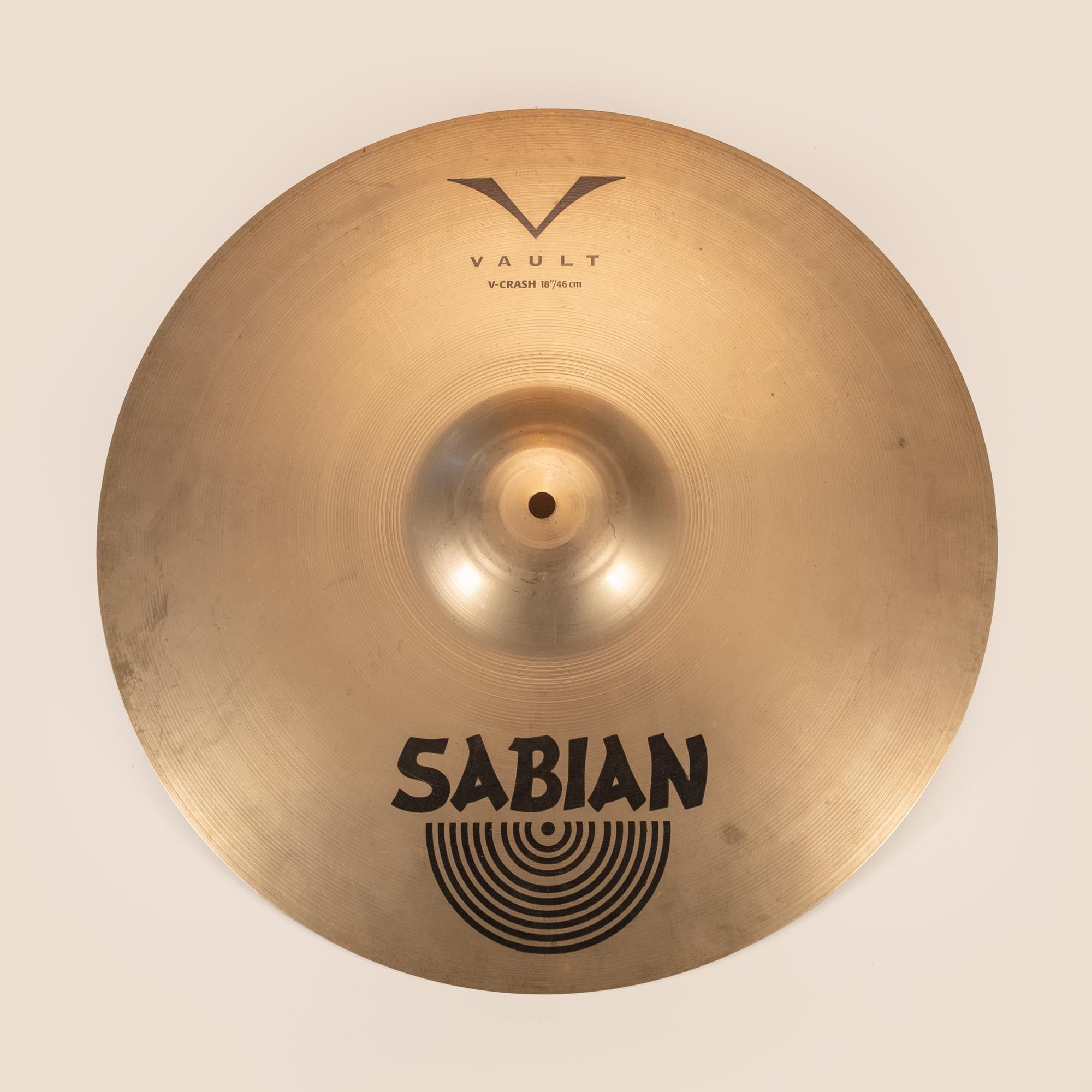 Sabian 18-inch Vault Crash Cymbal, preowned, showing its shiny surface and detailed bell, ideal for versatile percussion sounds.