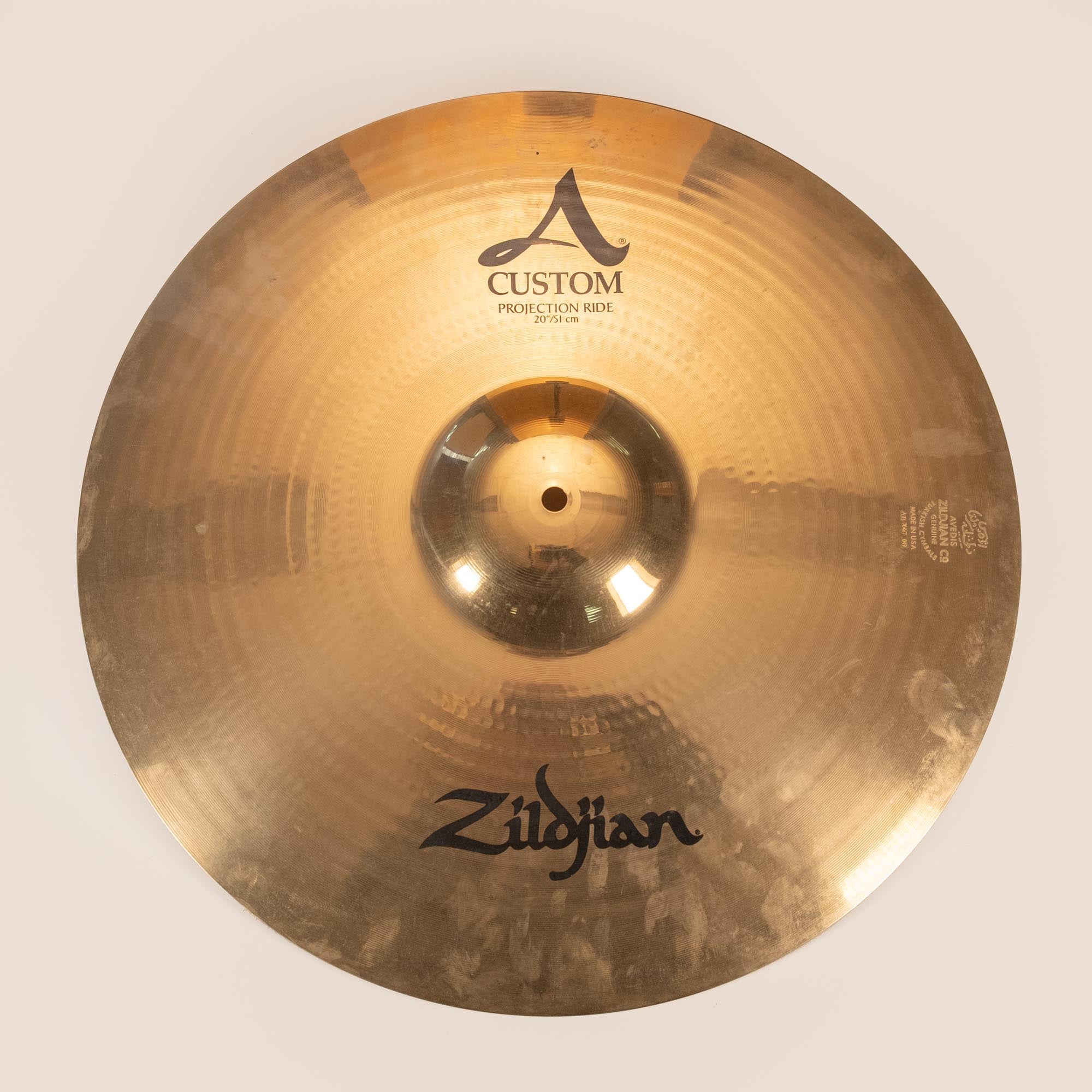 Preloved Zildjian 20-inch A Custom Projection Ride Cymbal showing its polished surface and detailed hammer marks.